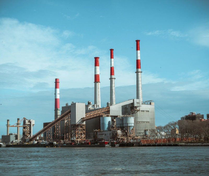 Smokestacks by the river